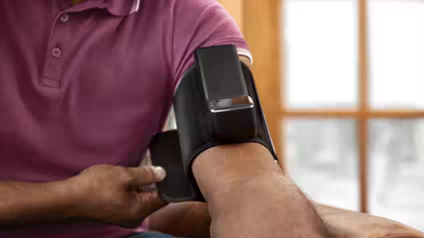 Image of a man using the Garmin Index BPM, Blood Pressure Monitor
