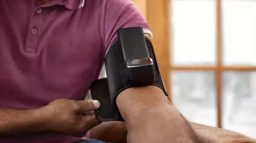 Image of a man using the Garmin Index BPM, Blood Pressure Monitor