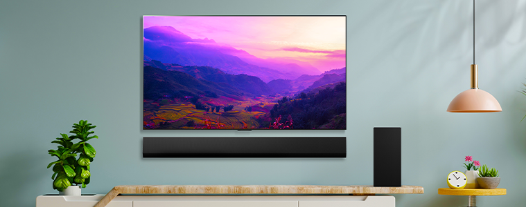 A big screen tv mounted on a modern living room wall