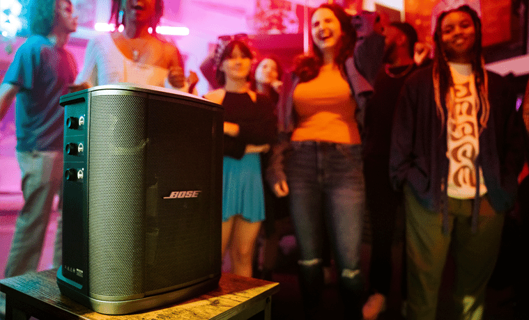 The Bose S1 Pro Wireless PA System plays music at a lively party