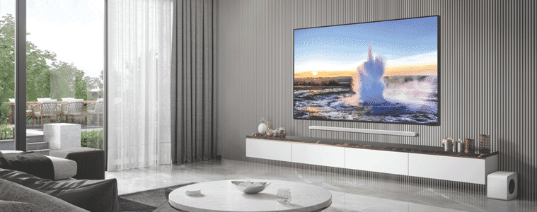 A UHD TV is mounted on a wall in a sleek modern living room