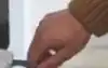 Person removing the dust bag from a roborock vacuum auto-empty station