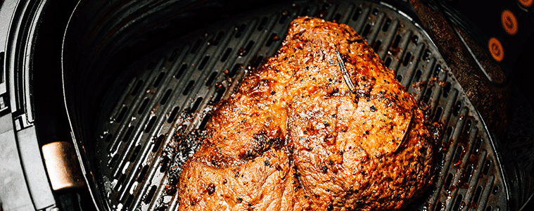 Beef steak with rosemary seared to perfection in the drawer of an air fryer