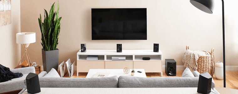 A living room with an extensive Logitech surround sound system