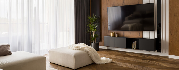 A large TV in a stylish modern living room