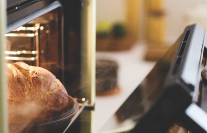 Haier mid-grey oven in a green kitchen