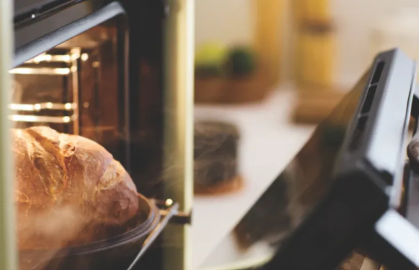 Haier mid-grey oven in a green kitchen