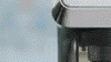 Man pressing button on his De'Longhi Coffee Machine.