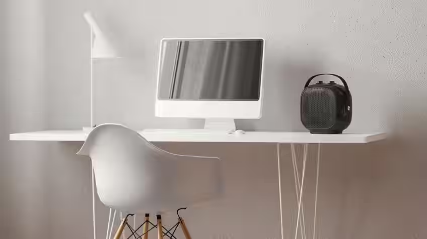 lifestyle image of an ewt portable heater on a study desk