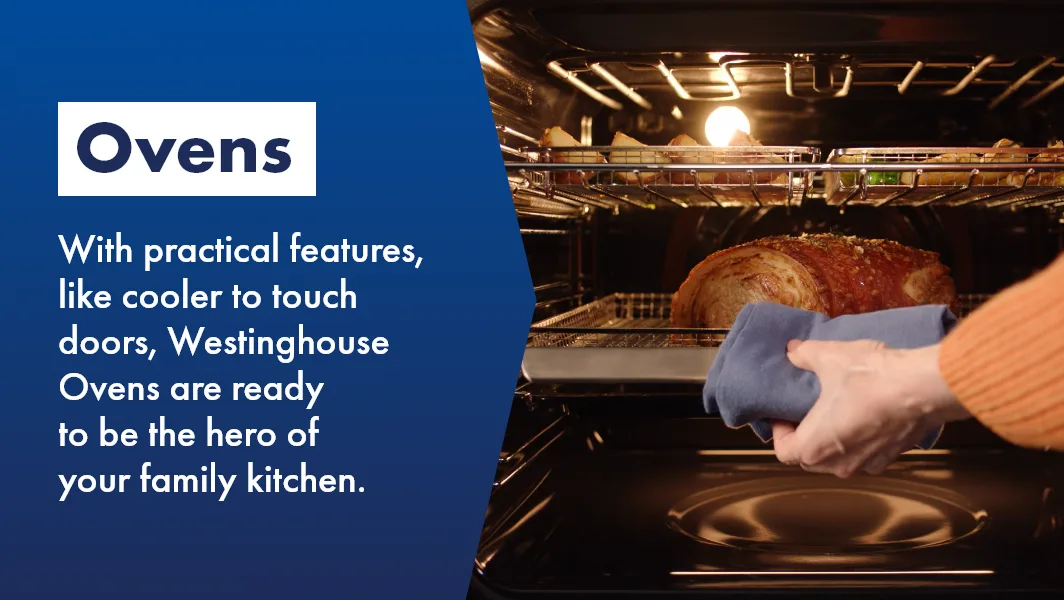 Woman taking perfect roast out of Westinghouse oven, the hero of your family kitchen.