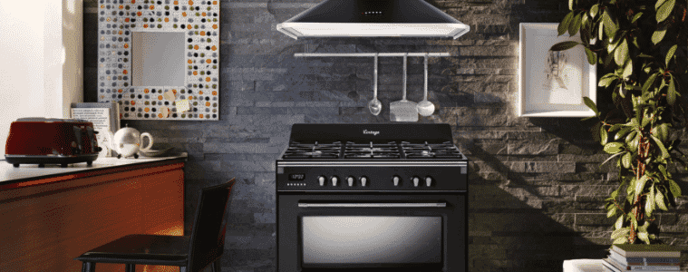A black freestanding oven in a industrial kitchen