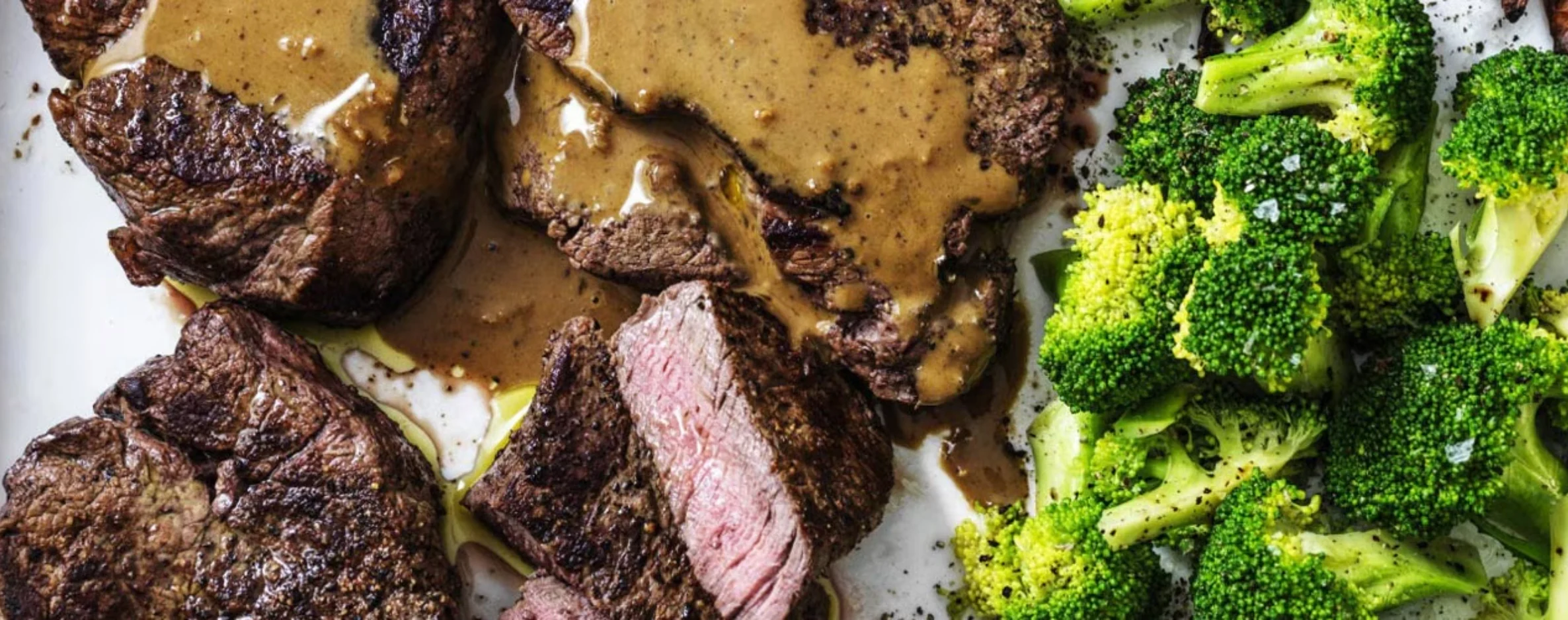 Close up image of Westinghouse's Steak Diane on a plate with broccoli