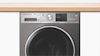 Close up image of a Fisher & Paykel Auto Dosing washing machine.