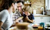 Cheerful family having fun during their meal at the dining table