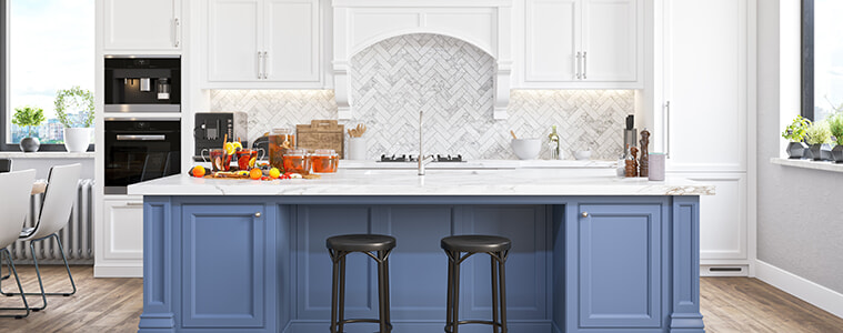 Luxury Hamptonsstyle kitchen with marble benchtops island bench with blue cabinetry integrated fridge and builtin wall oven and coffee machine