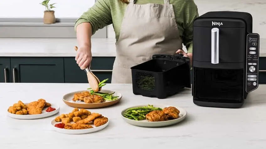 Ninja DoubleStack XXXL 95L 2 Drawer Air Fryer on kitchen bench surrounded by food