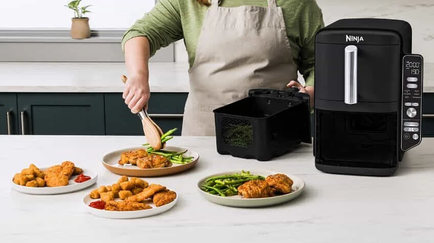 Ninja DoubleStack XXXL 95L 2 Drawer Air Fryer on kitchen bench surrounded by food