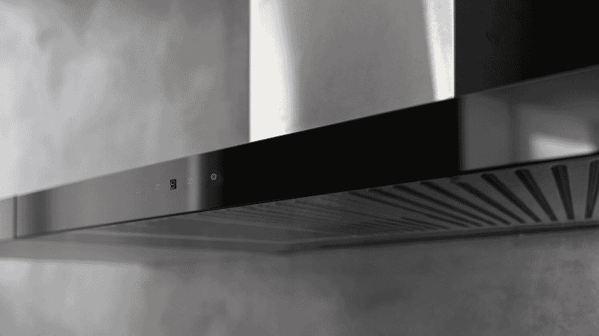 close up of metal Solt rangehood against grey wall