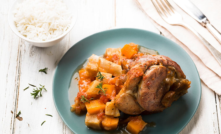 Lamb Shanks with a side of rice on a table