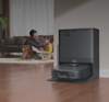 Family sitting together next to eufy robot vacuum