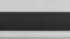 Close up of sleek LG soundbar underneath TV.