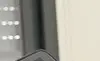 A person viewing controlling their home security via a tablet