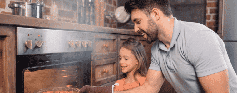 a father and daughter taking dinner out of their 