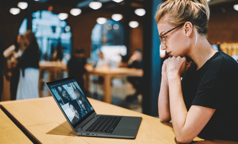 Woman using her Lenovo laptop at a cafe on the go 