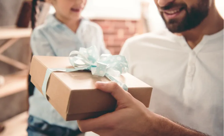 Daughter giving Dad a gift