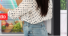 Image of a woman scanning the food inside her Samsung AI Fridge