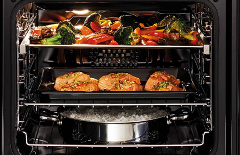 Lifestyle image of Westinghouse oven cooking lots of food with a 70L capacity, 