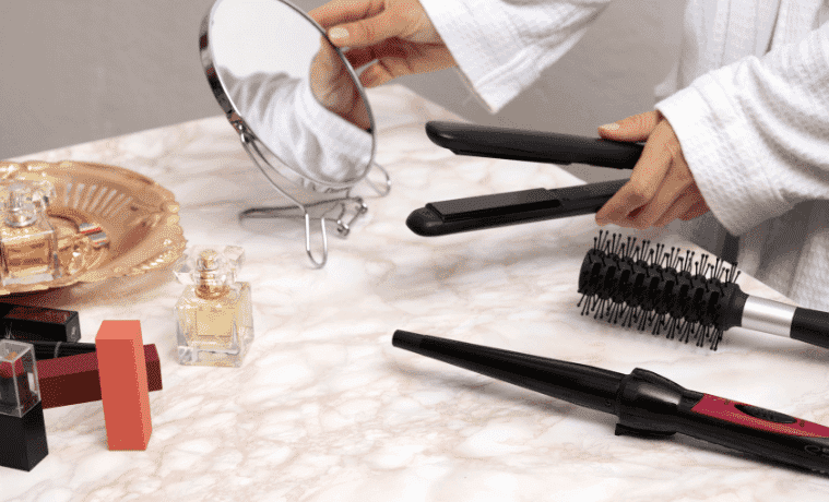 Hair tools laid out on a bathroom counter