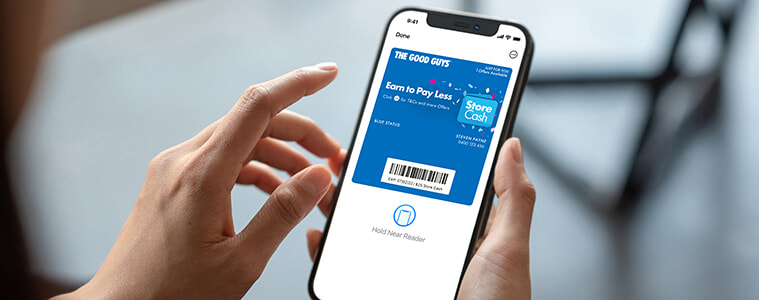 A lady showing her digi wallet storecash 