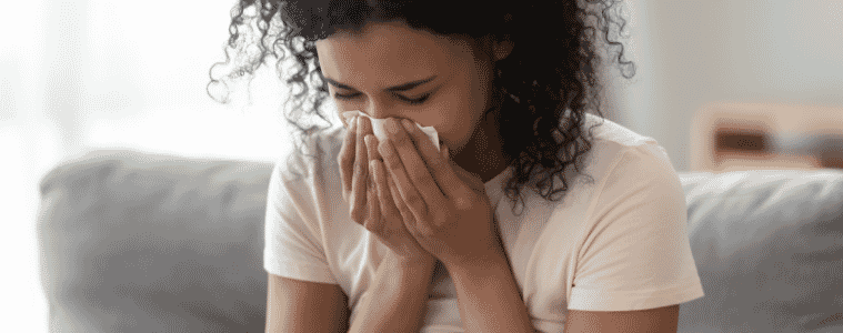 Woman with allergies at home 