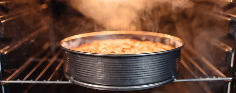 Perfectly cooked cake gives off steam as oven is opened