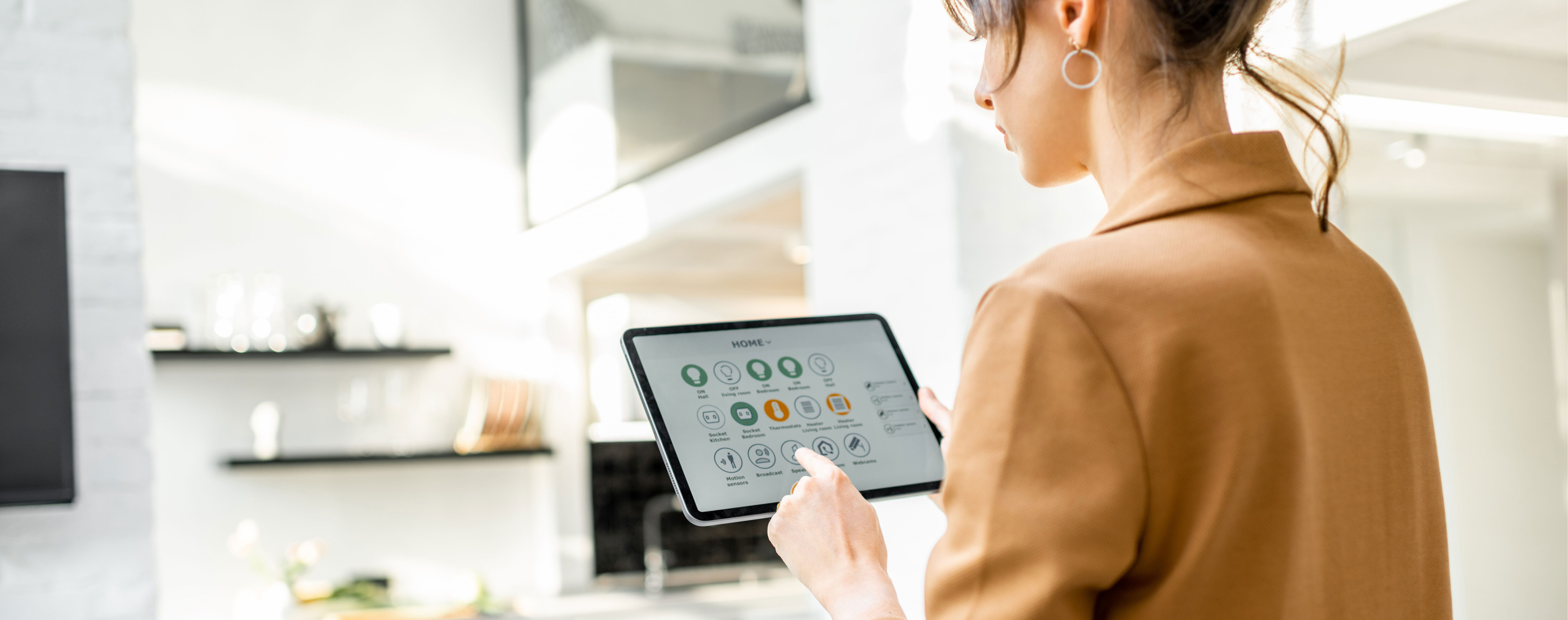 Woman Adjusting Smart Home Settings On Tablet