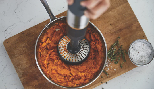 Image of a Kenwood Stick Mixer being used to blend