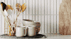 Lifestyle image of a modern kitchen featuring a Westinghouse quad door fridge.