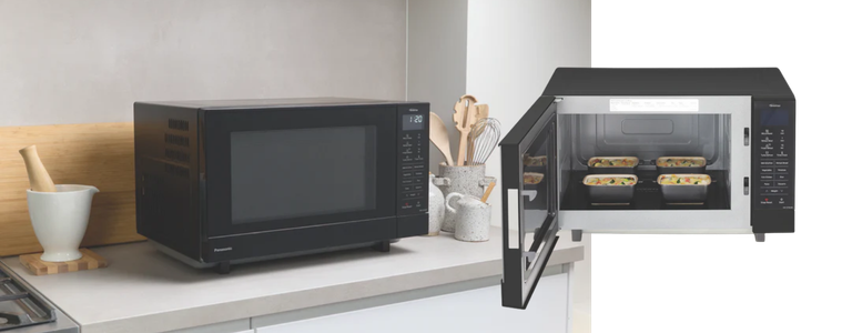 Image of a Panasonic 27L 1000W Flatbed Microwave Black in a kitchen
