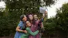 Family taking photo on Chromebook.