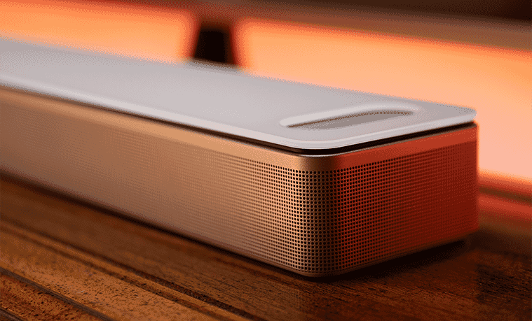 The Bose Ultra Soundbar on table in front of a Tv