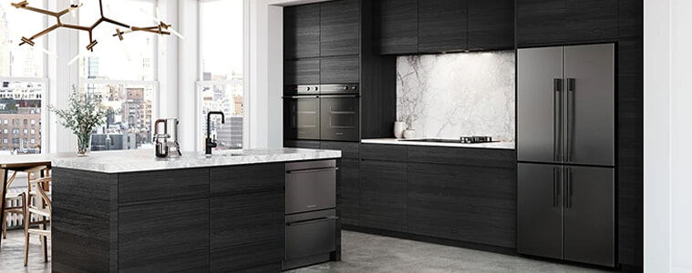 A black timber kitchen with white countertops and black appliances