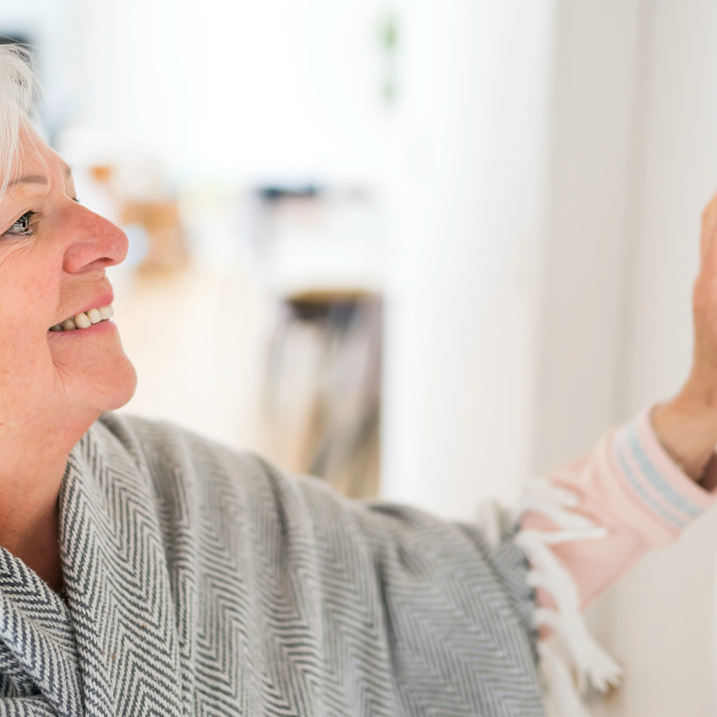 woman checks thermostat
