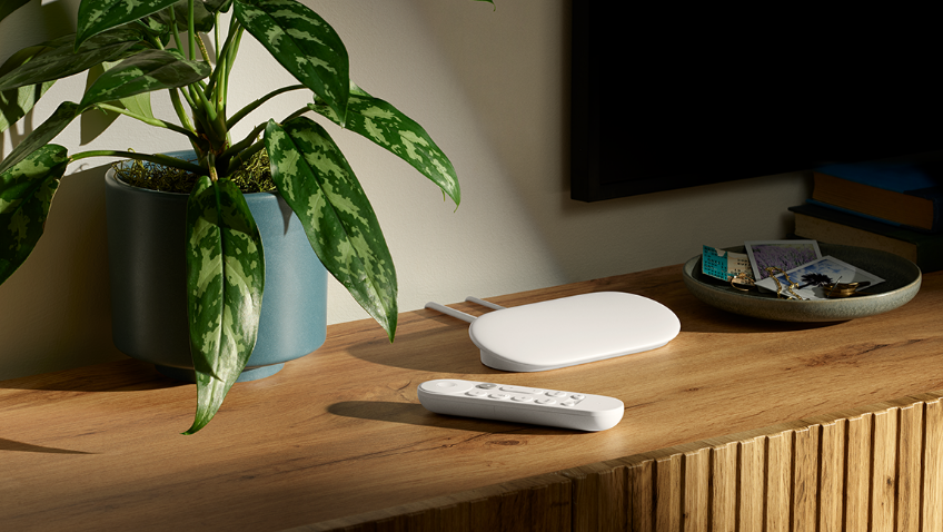 Lifestyle image of a Chromecast on a tv unit