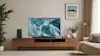 LG QNED TV with blue waves on screen.