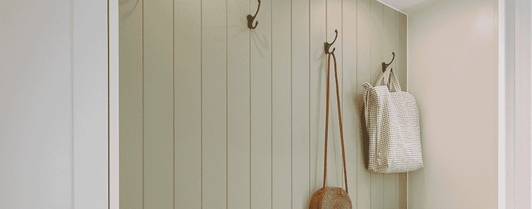 Detail of an upholstered bench seat with builtin shoe storage underneath