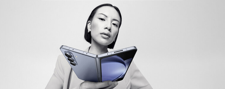 A woman holds the Samsung Galaxy Z Fold5