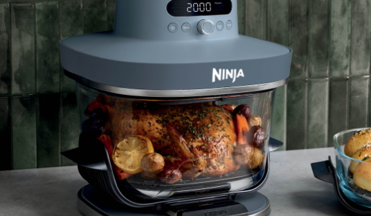 Image of the Ninja Crispi Pro cooking up a roast chicken in 5.7L glassware