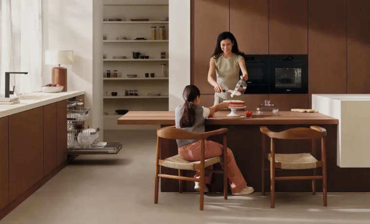 family cooking in Miele kitchen
