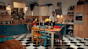 Man preparing a meal in his retro looking kitchen.